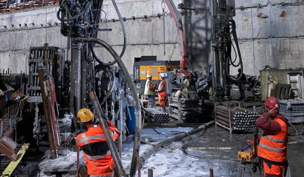 compressor in use at a construction yard by builders